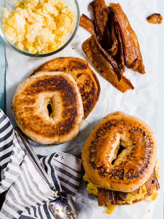 French Toast Bagel topped with eggs, cheese and smokey bacon, making for a sweet and savory breakfast sandwich everyone is going to love! 