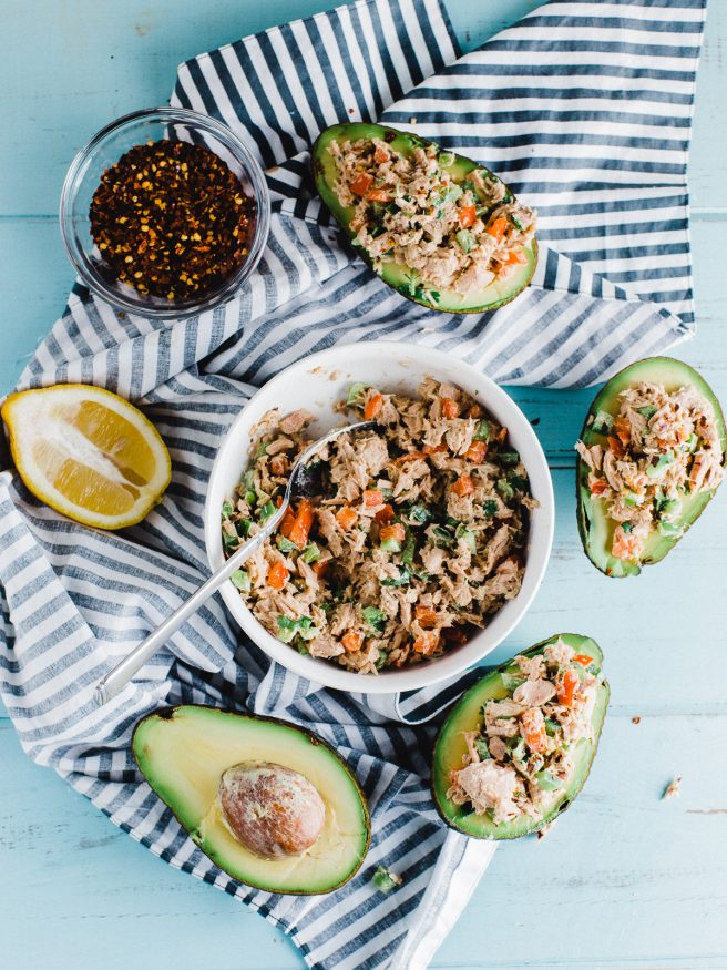 Tuna Salad Avocado Boat with a red pepper flakes to add some heat. Fresh vegetables with a little Dijon mustard and mayonnaise mixed with tuna. Delicious!