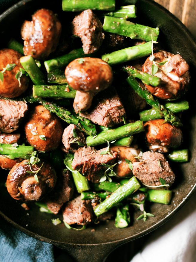 Steak and mushroom bites with filet mignon, baby portabello and asparagus. Seared in a cast iron skillet with butter, herbs and garlic. 
