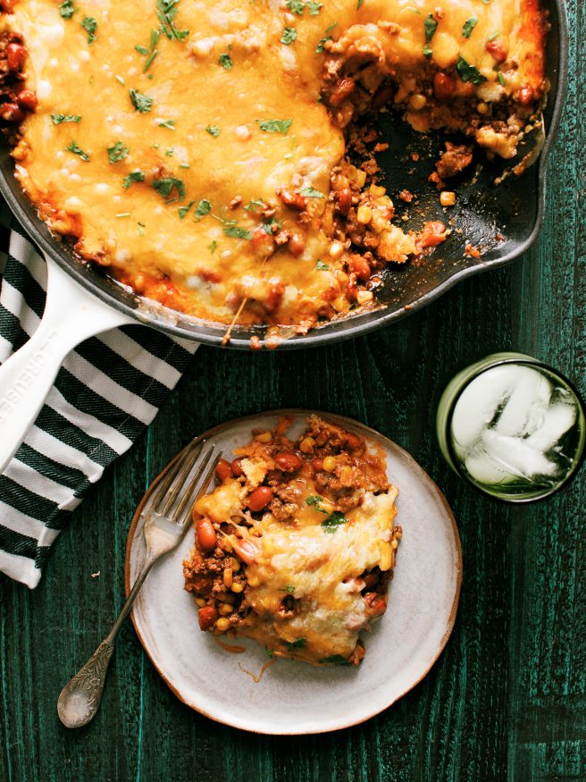 Tamale Pie is perfect comfort food! Ground beef beans,fire roasted corn with a taco seasoning, on top of cornbread and loaded with cheese.