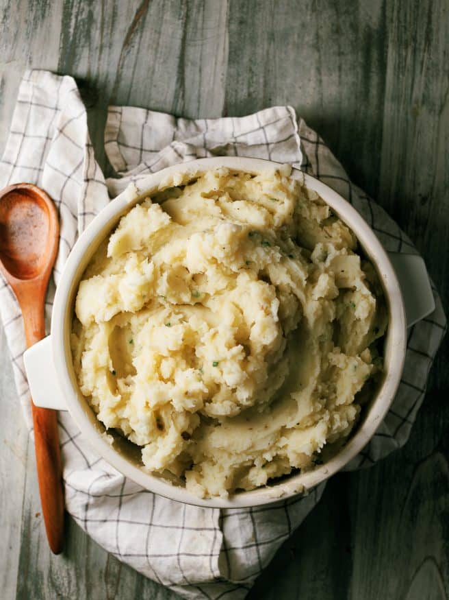 Classic mashed potatoes with a garlic infused butter and fresh chopped chives. Amazing flavor and texture that will make you think your mother made it!