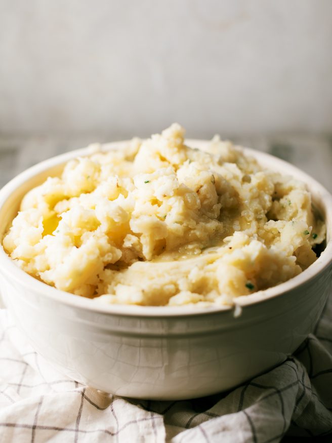 Classic mashed potatoes with a garlic infused butter and fresh chopped chives. Amazing flavor and texture that will make you think your mother made it!