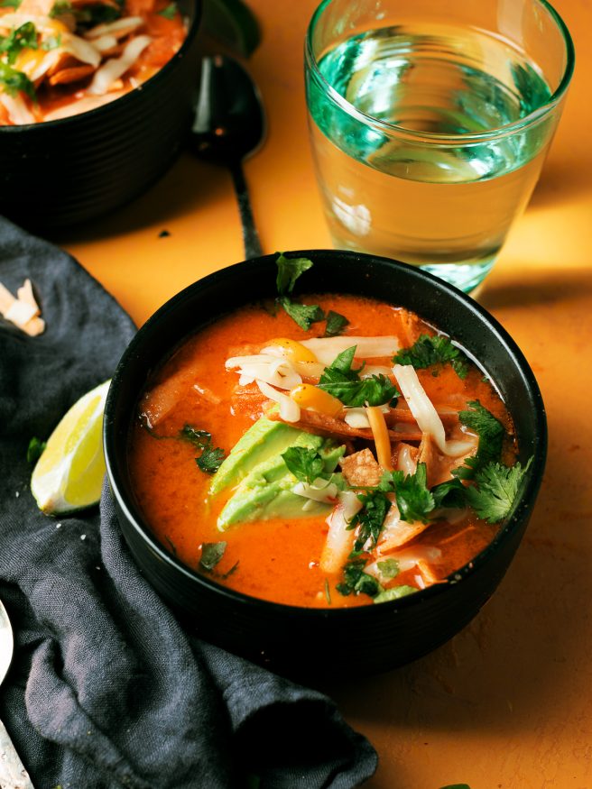 Smoked tomato onion and jalapenos to add a beautiful smoky flavor to this chicken tortilla soup that is comfort food at its best!

