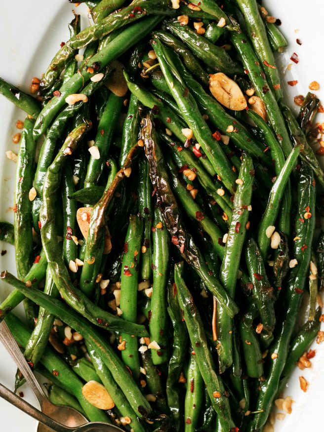 These blistered green beans are fried lightly in oil until blistered, then tossed in a spicy Asian cuisine inspired sauce that is out of this world! 