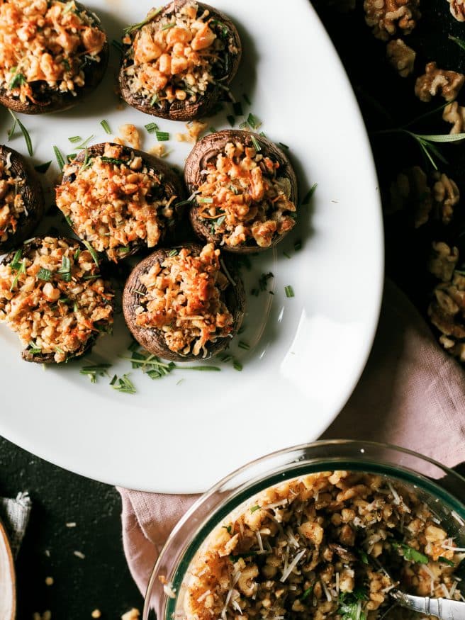 These walnut and rosemary stuffed mushrooms are the perfect appetizer to put together for the holidays. Comes together in 15 minutes!