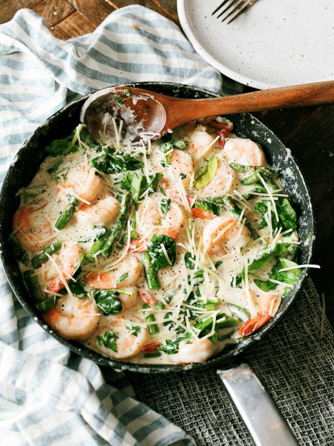  This Keto Shrimp Alfredo is a simple from scratch Alfredo sauce with sauteed shrimp asparagus and spinach. Whats even better is it can double for a pasta as well feeding the carb-lovers in your family all at once! 