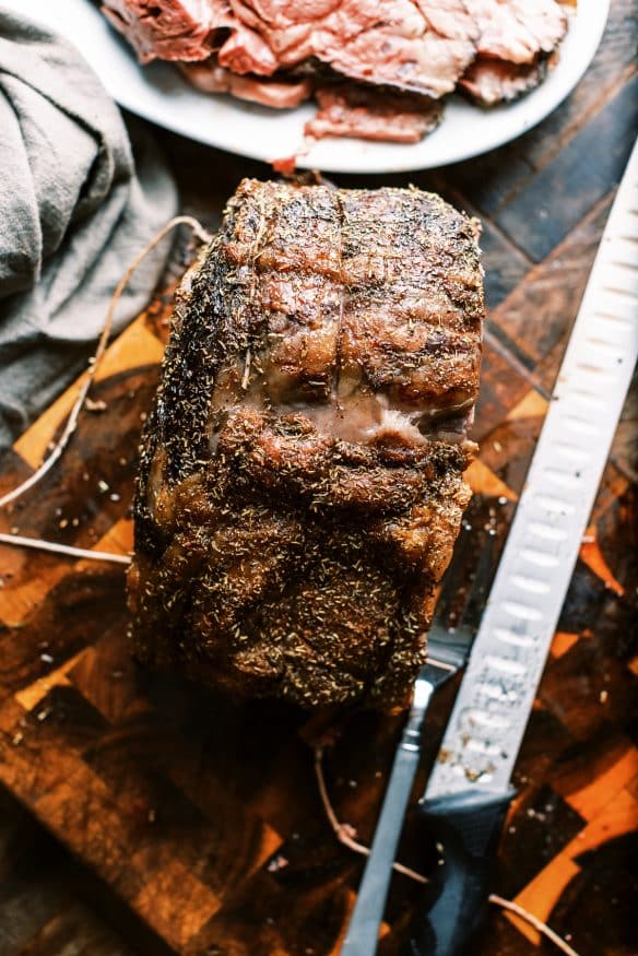 Prime Rib roast with a black truffle sea salt and herb rub that is so juicy tender and full of flavor you'll want to make this every year!