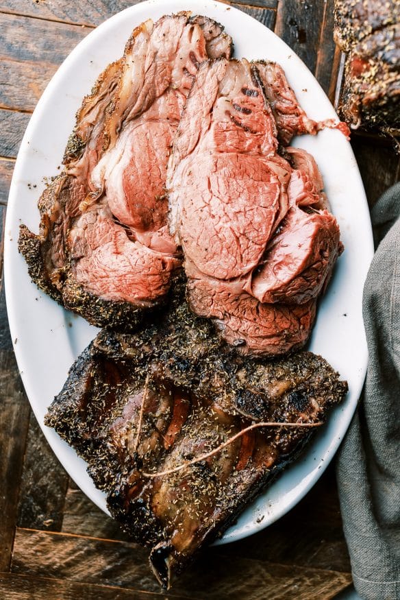 Prime Rib roast with a black truffle sea salt and herb rub that is so juicy tender and full of flavor you'll want to make this every year!