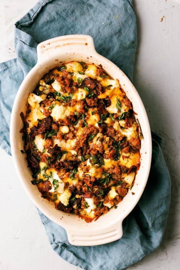 This loaded cauliflower casserole is loaded with cheese, scallions, sausage bacon and serrano peppers and perfect low carb side!