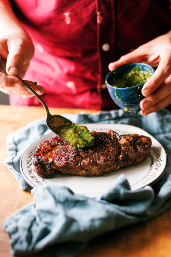 This grilled Ribeye steak is smothered with a spicy and zesty hatch chili verde sauce. It's the perfect combo heading into grilling season!