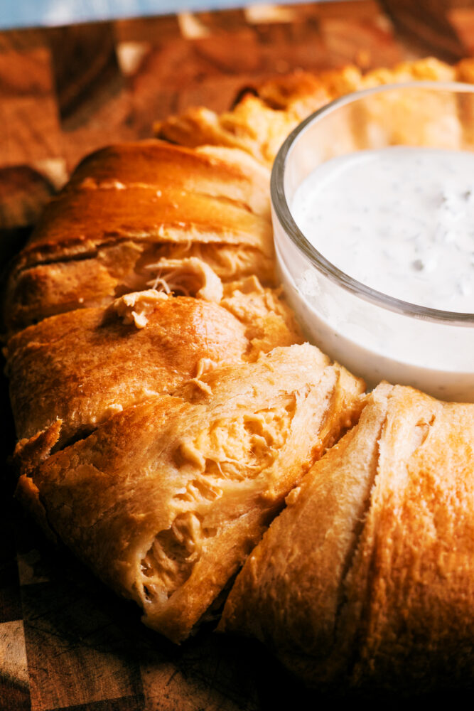 This Buffalo Chicken Crescent Ring checks all the boxes – it’s quick, packed with buffalo flavor, wrapped in  buttery crescent rolls that's perfect for feeding a crowd.