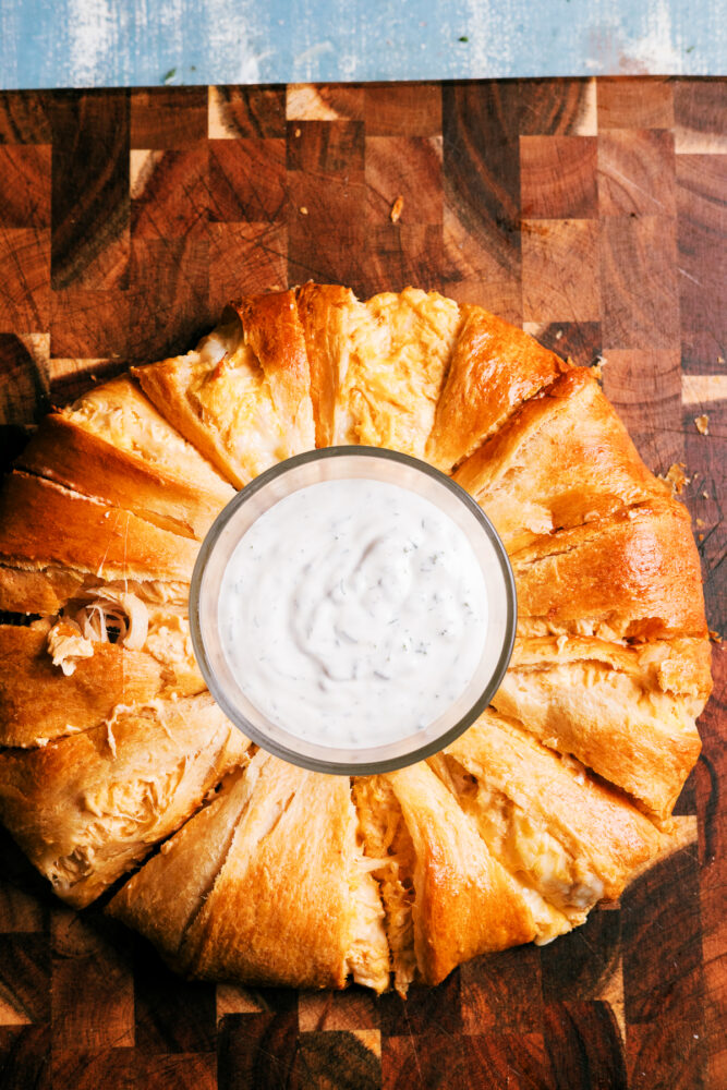 This Buffalo Chicken Crescent Ring checks all the boxes – it’s quick, packed with buffalo flavor, wrapped in  buttery crescent rolls that's perfect for feeding a crowd.